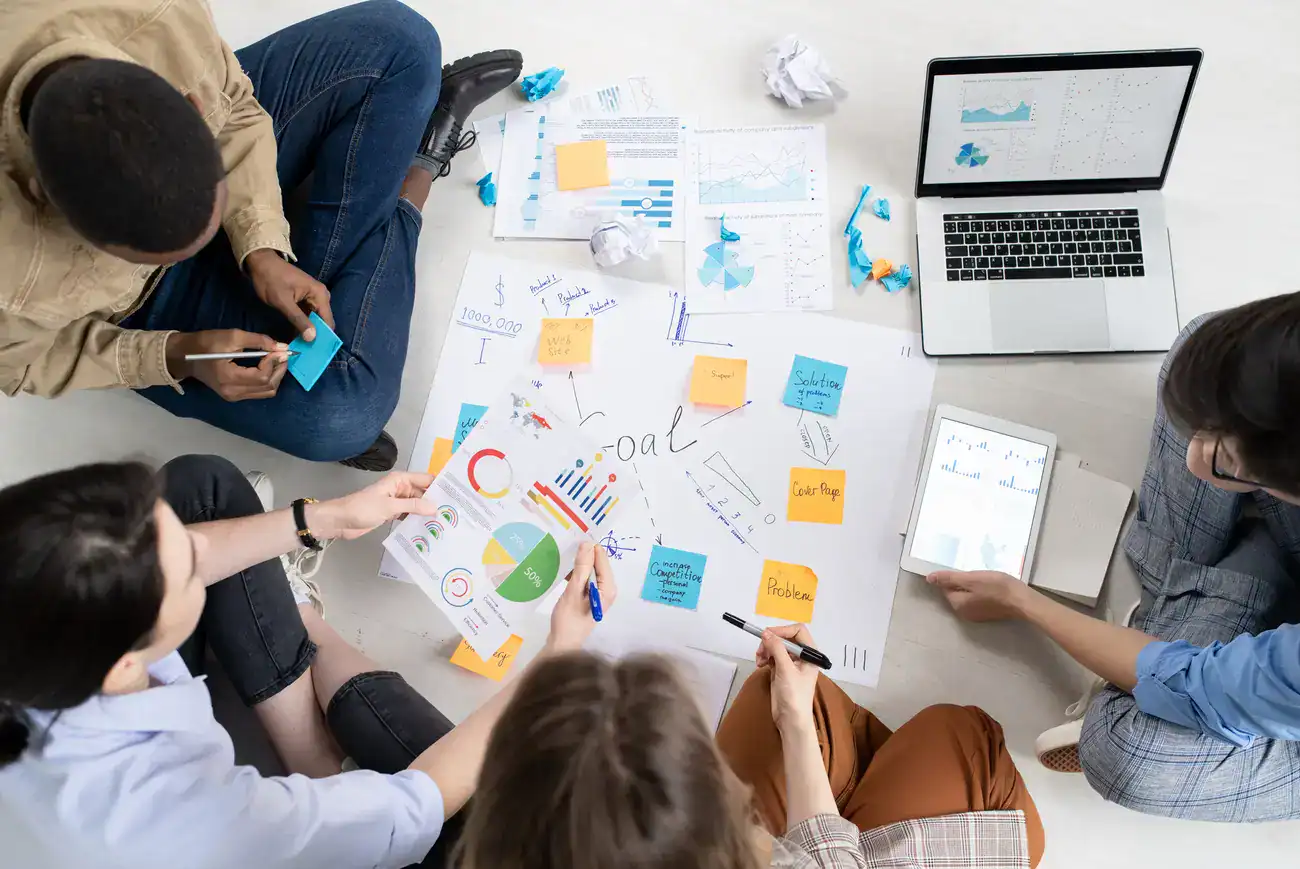 A marketing team creates a content strategy using data and sticky notes