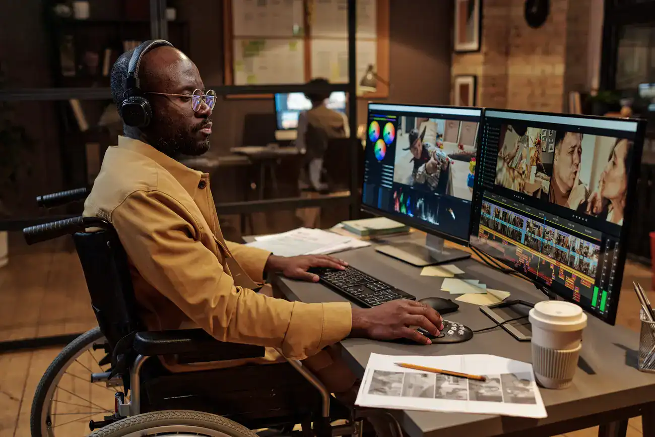 A video editor working on a project in a professional editing suite